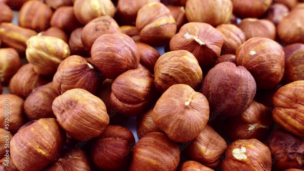 Peeled brown hazelnuts circle rotation close up Peeled brown hazelnuts circle rotation close up