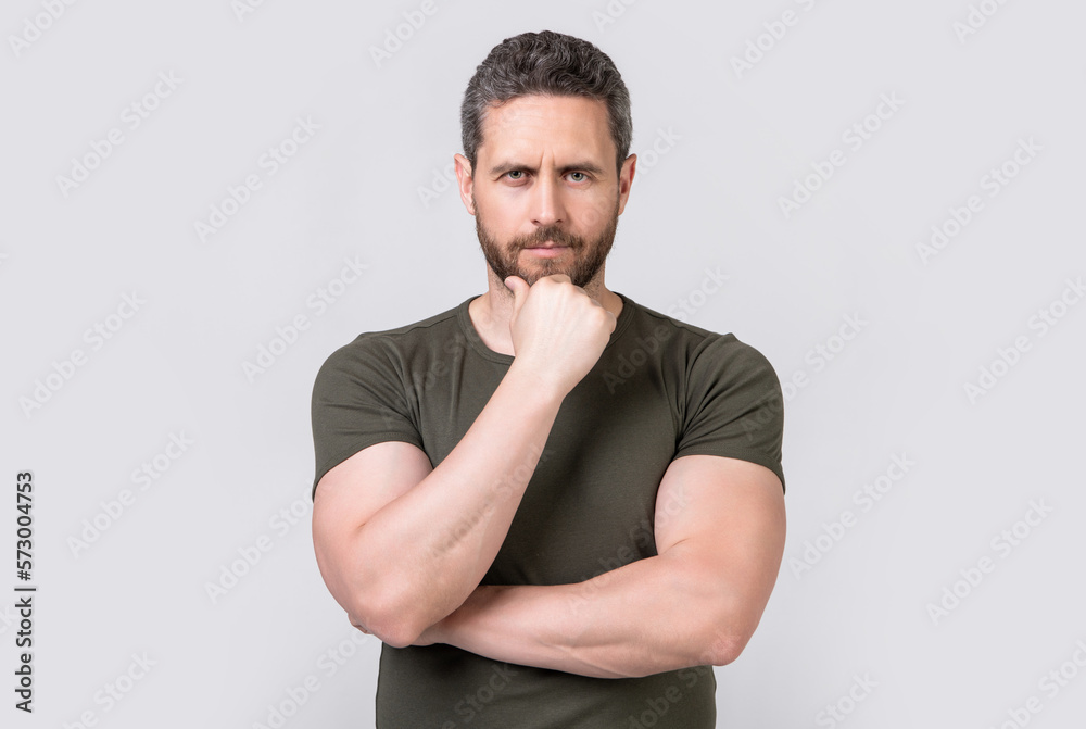 charismatic caucasian man with stubble isolated on grey background. caucasian man with stubble charismatic caucasian man with stubble isolated on grey background. caucasian man with stubble