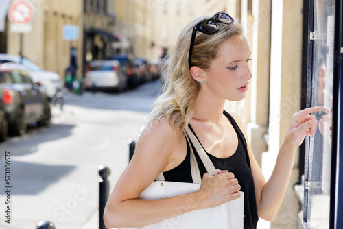 woman looking at the shop window