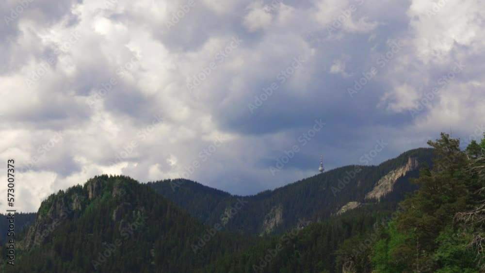 Tower Snezhana on peak of Snezhana covered with spruce forests in Rhodope mountains Tower Snezhana on peak of Snezhana covered with spruce forests in Rhodope mountains