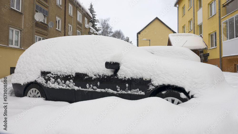 City of Liptovský Hrádok, Slovakia - February 4.2023 : The storm covered cars, roads and houses in northern Slovakia with snow. City of Liptovský Hrádok, Slovakia - February 4.2023 : The storm covered cars, roads and houses in northern Slovakia with snow.