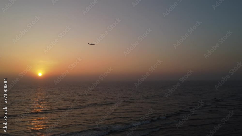 Sunset and plane landing on Cox's bazar sea beach Sunset and plane landing on Cox's bazar sea beach