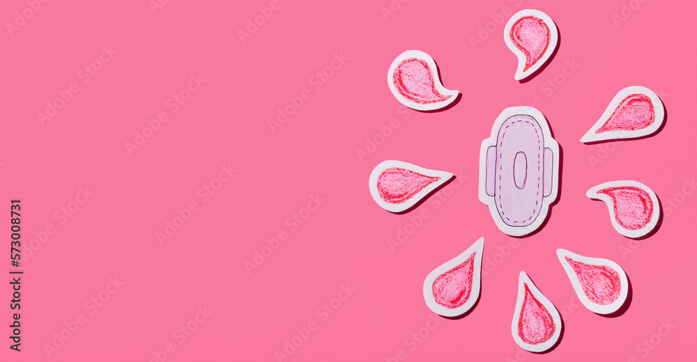 Sanitary napkin with red drops of blood cut out of paper on a pink background. Female menstruation. Menstruation. Banner. Copy space.