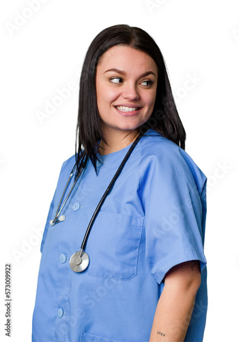 Young nurse woman isolated looks aside smiling  cheerful and pleasant.