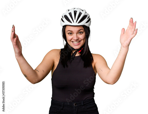 Young caucasian woman wearing a helemet isolated receiving a pleasant surprise, excited and raising hands.