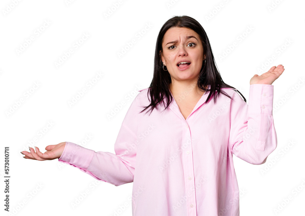 Young caucasian woman isolated holds copy space on a palm, keep hand over cheek. Amazed and delighted. Young caucasian woman isolated holds copy space on a palm, keep hand over cheek. Amazed and delighted.