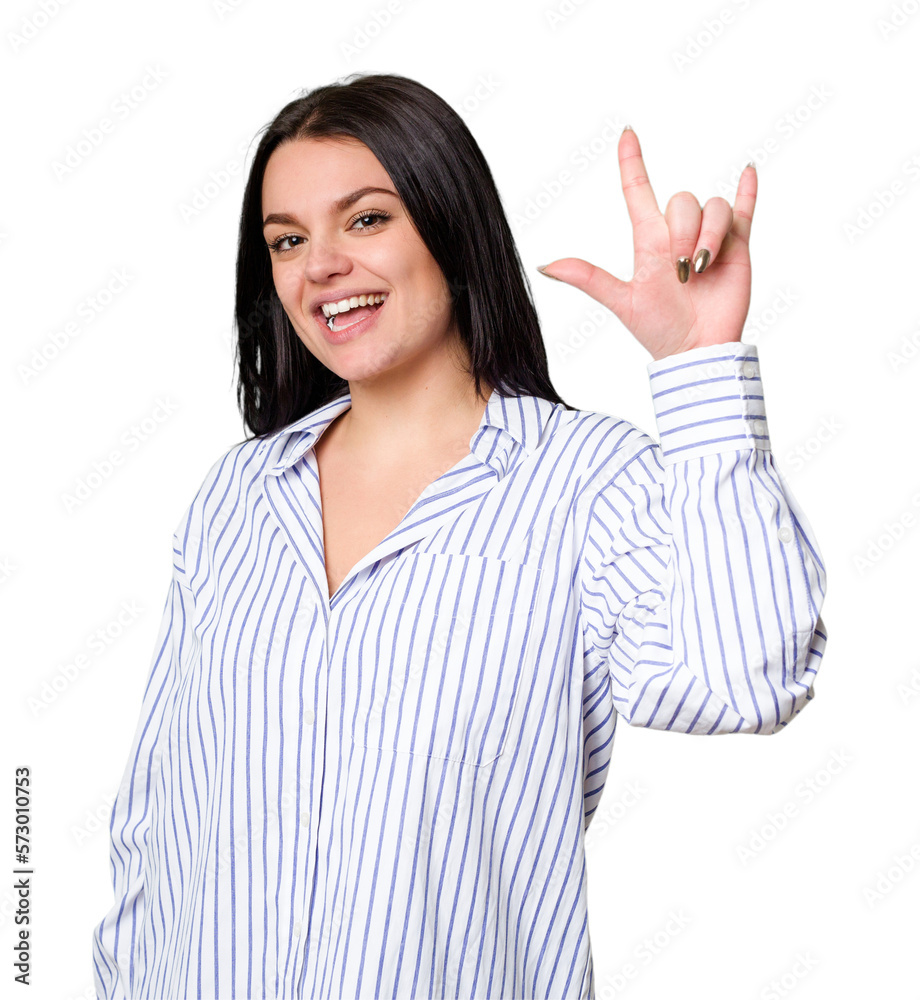Young caucasian woman isolated showing a horns gesture as a revolution concept. Young caucasian woman isolated showing a horns gesture as a revolution concept.