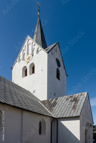 Der weisse Dom von Thisted leuchtet hell vor einem blauen wolkenlosem Himmel in der Morgensonne, Jütland, Dänemark photo