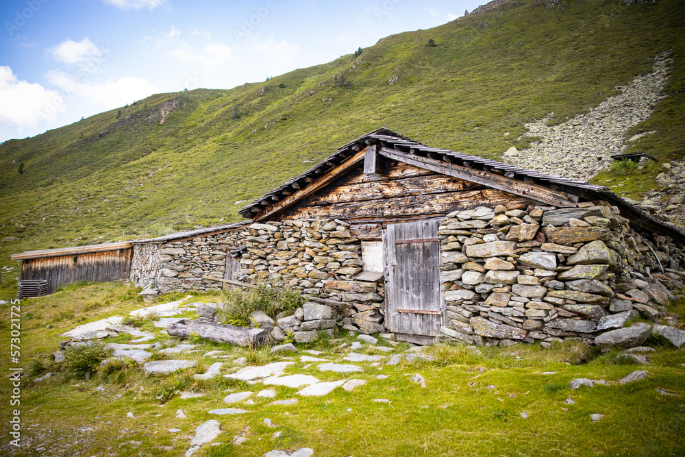 Obraz premium stone country cottage with wooden door no trees