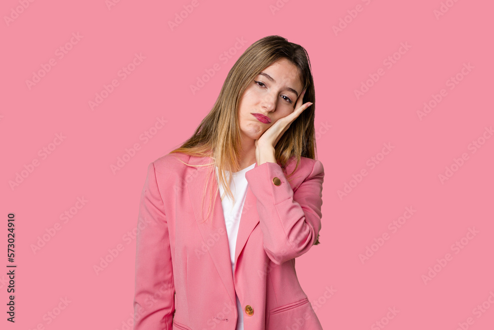 Young blonde posing for a portrait isolated, exuding natural beauty and radiance who is bored, fatigued and need a relax day. Young blonde posing for a portrait isolated, exuding natural beauty and radiance who is bored, fatigued and need a relax day.