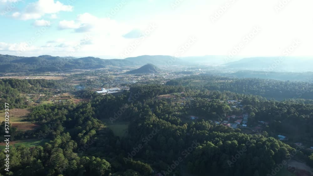 Aerial Moving Left Over Lush Green Forests With Bright Sky Aerial Moving Left Over Lush Green Forests With Bright Sky