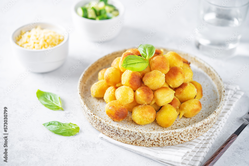 Fried potato gnocchi with cheese filling Fried potato gnocchi with cheese filling