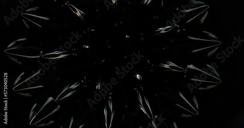 Magnetic fluid. Ferrofluid. Black liquid surface. Abstract background. Natural phenomenon of magnetism ferro fluidic substances under the action of a neodymium magnet can create really impressive. photo