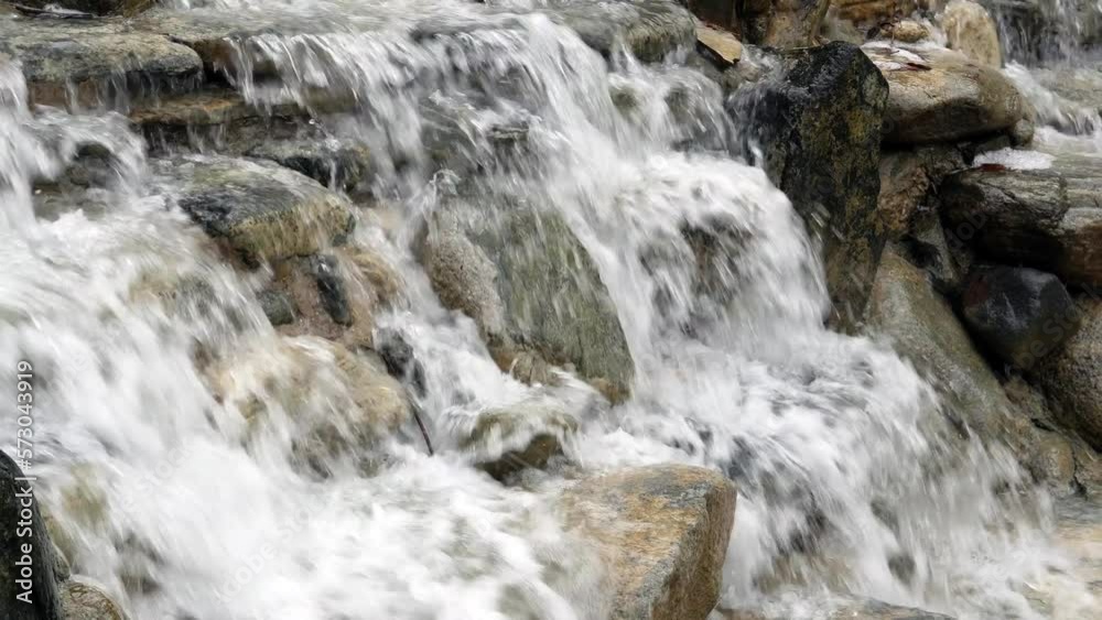 water flowing over rocks water flowing over rocks