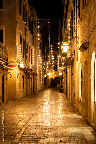 Empty Dubrovnik city streets during winter, decorated withchristmas lamps