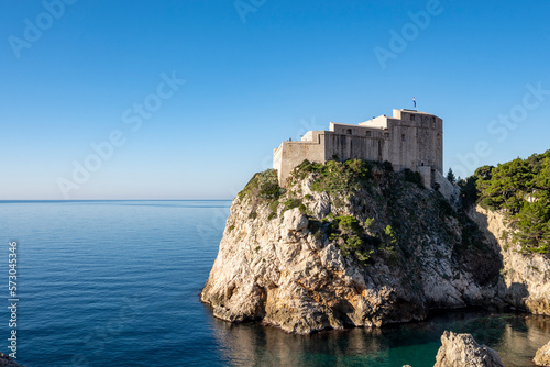 Amazing Dubrovnik city fortified walls with Lovrinac stronghold on the highest rocky cliff above the sea