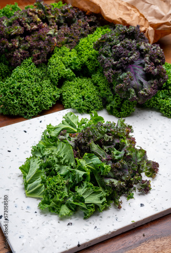 Vegetarian food, leaves of winter vegetable green and purple kale cabbage close up