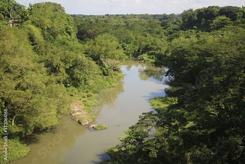 River in green landscape of Cuba, Caribbean photo