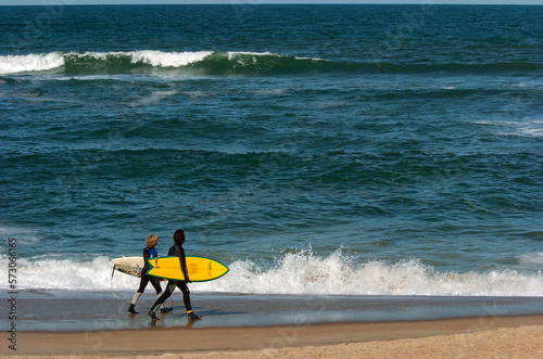 Heading out to surf the waves on the Outer Banks; North Carolina