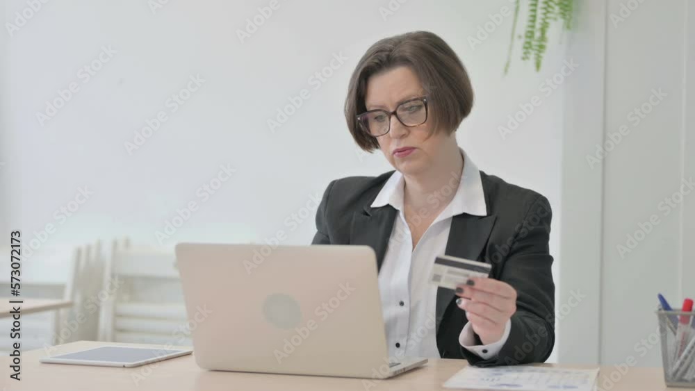 Old Businesswoman Unable to make Online Payment on Laptop Old Businesswoman Unable to make Online Payment on Laptop