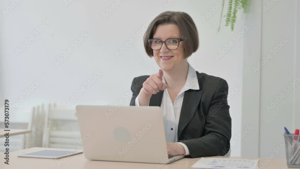 Old Businesswoman Shocked While Working on Laptop Old Businesswoman Shocked While Working on Laptop