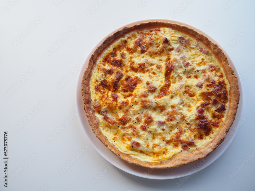 Homemade traditional french Quiche Lorraine, real recipe, white background, space for text Homemade traditional french Quiche Lorraine, real recipe, white background, space for text