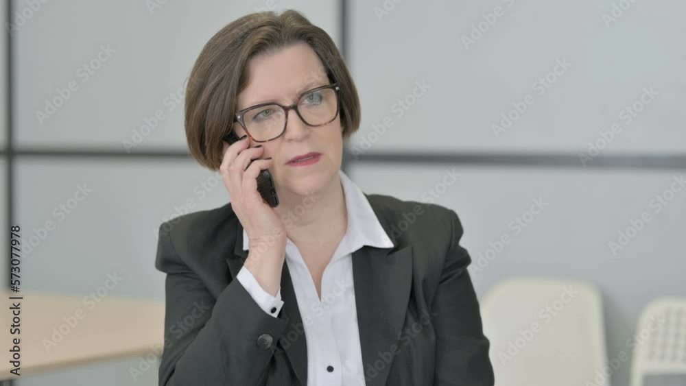 Portrait of Old Businesswoman Talking on Phone Portrait of Old Businesswoman Talking on Phone