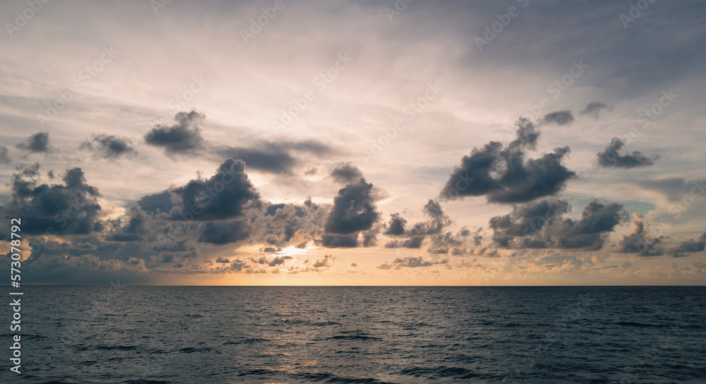 Dark storm clouds background. Dramatic dark clouds sky. Dark cloudy tropical sky at sunset sea background. Stormy cloudy sky. Dark storm clouds background. Dramatic dark clouds sky. Dark cloudy tropical sky at sunset sea background. Stormy cloudy sky.