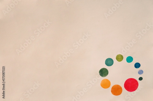 Multi-Color Circles in Round Pattern in Lower Corner of White Background
