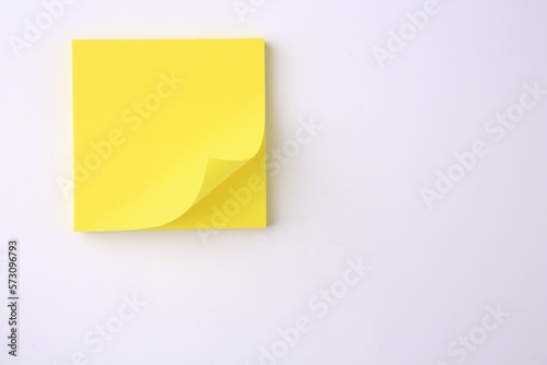 Blank paper note on white background, top view. Space for text