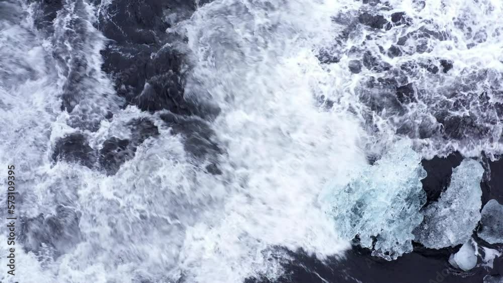 Aerial View Of Rushing Waves Hitting Icebergs Aerial View Of Rushing Waves Hitting Icebergs