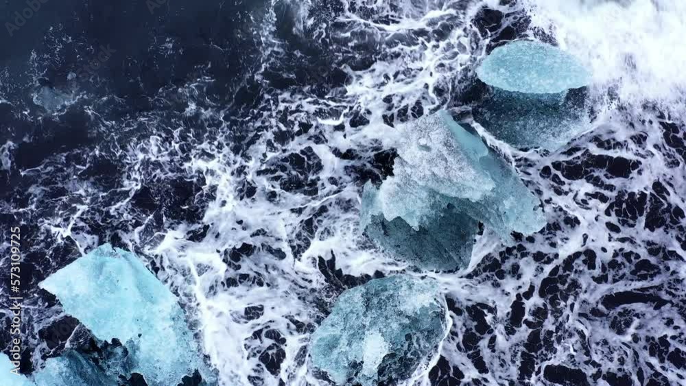 Big Waves Crashing Over Iceberg Fragments Big Waves Crashing Over Iceberg Fragments