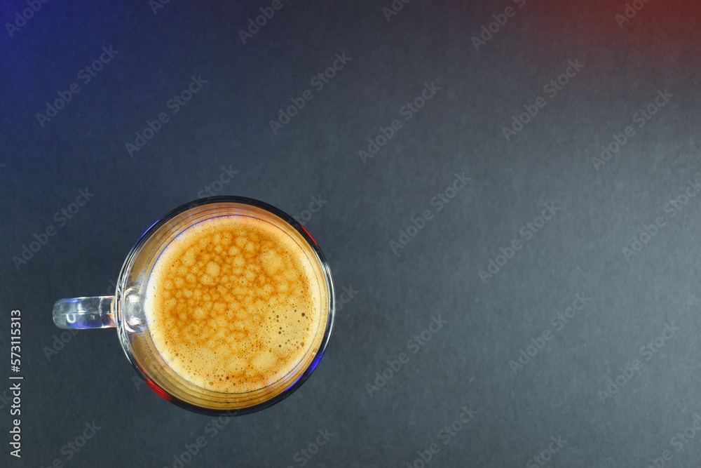 hot black coffee on black table with neon lights hot black coffee on black table with neon lights