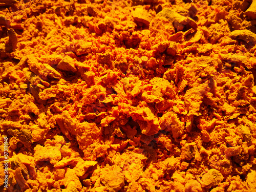 crushed yellow Turmeric and dried in the sun