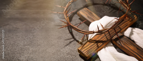 Crown of thorns  wooden cross and shroud on grey background with space for text