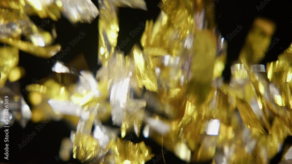 Bunch Of Silver And Gold Confetti On Black Background Bunch Of Silver And Gold Confetti On Black Background