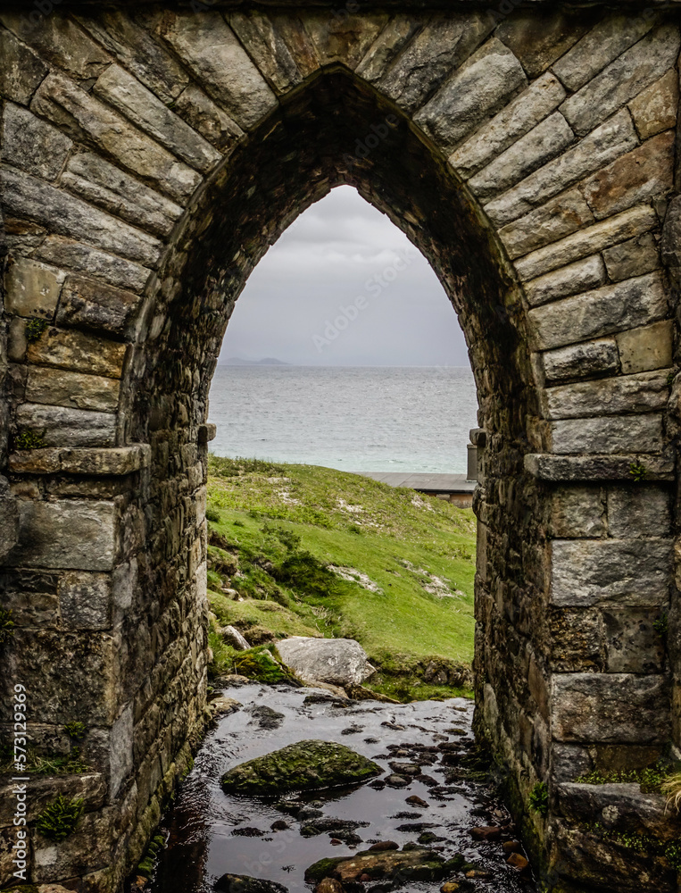 An arch below a stone bridge at Keem beach, Achill Island, Ireland