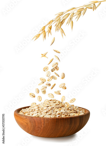 oatmeal falling from oat ears in bowl isolated on white photo