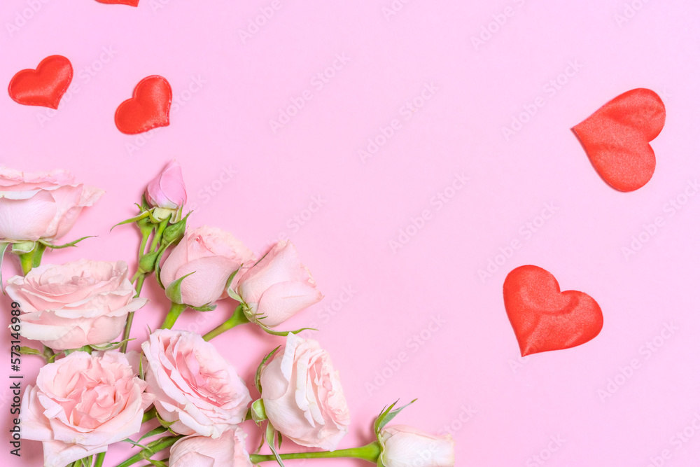 Lace ribbon and hearts and pink rose flowers on a pink background. Happy Valentine's Day, Mother's Day, birthday concept. Romantic flat composition.