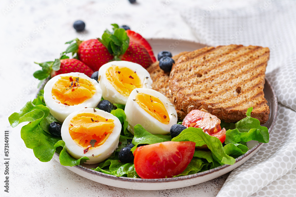 Healthy breakfast. Toast with strawberry and egg. Healthy balanced food. Top view, flat lay Healthy breakfast. Toast with strawberry and egg. Healthy balanced food. Top view, flat lay