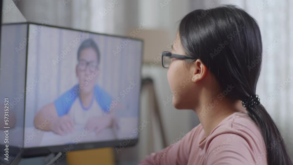 Close Up Of Asian Teen Girl Programmer Waving Hand Having Video Conference On Desktop Computer While Creating Software Engineer Developing App, Program, Video Game At Home. Terminal With Coding Langua Close Up Of Asian Teen Girl Programmer Waving Hand Having Video Conference On Desktop Computer While Creating Software Engineer Developing App, Program, Video Game At Home. Terminal With Coding Langua