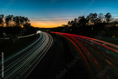 Heavy traffic on a highway at the blue hour. Cars leaving light trails on a highway. at the blue hour.