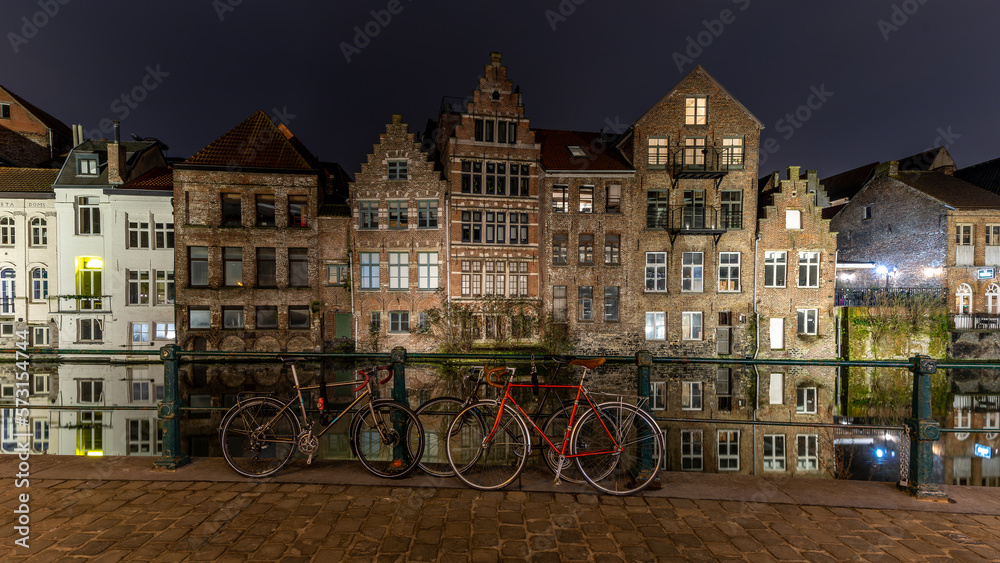 Cityscape at night bicycle and water reflection in Gent, Belgium in January 2023