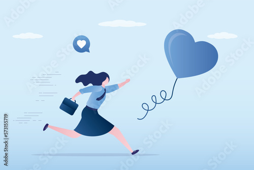 Young woman is looking for his love. Searching passionate job for happiness, ambition to find right career concept. Businesswoman chasing heart bubble ahead. Self motivation, chase dream. © naum