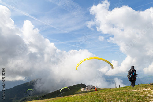  paraglides at takeoff on the top of mountain
