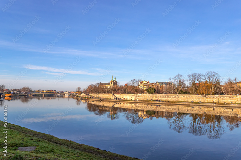 Fototapeta premium Krakow. Poland. Beautiful embankment of the Vistula River, with beautiful bridges. Sunny day. Sights of Krakow.