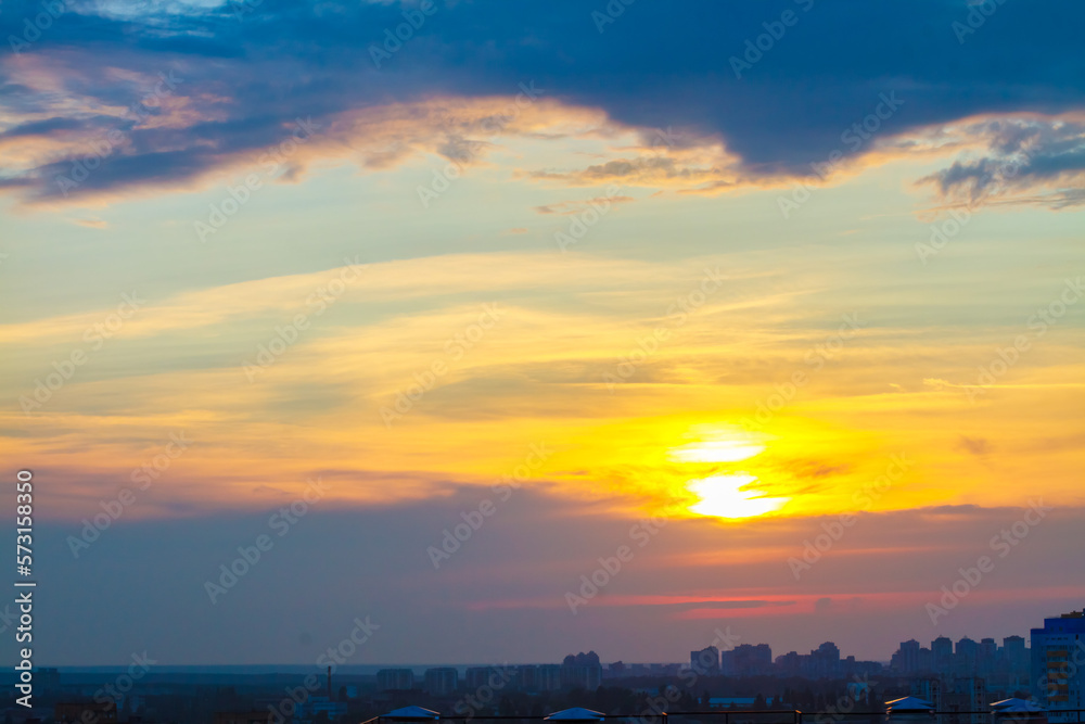 Beautiful sunrise or sunset. Sky with clouds. Atmospheric photography. Sunbeams through clouds and clouds.
