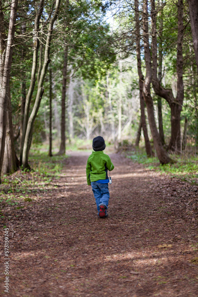 Little boy walking alone along trail in Bruce Peninsula National Park Little boy walking alone along trail in Bruce Peninsula National Park