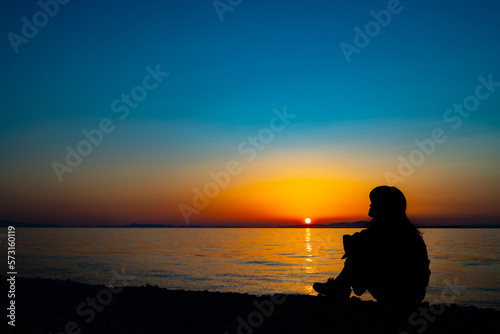 Silhouette of a woman twilight at sunset