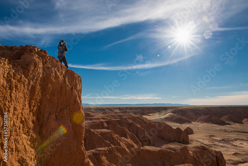 Woman photographing Gobi Desert, Mongolia photo